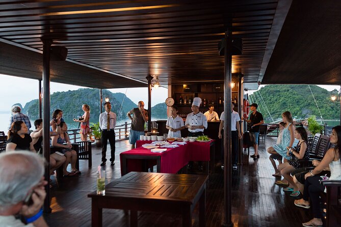 2D1N: Halong Bay 4-Star Cruise - Cave, Kayak, Swim, Meals - Day one evening: sunset, cooking and squid fishing