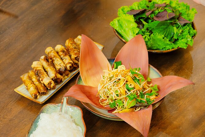 Experience Hanoi Cooking Class with Free Wine Tasting - A meal with coffee, liquor, and food stories