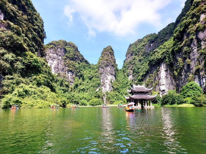 Hanoi: Hoa Lu, Trang An, and Mua Cave Full-Day Trip - Cycling through a village