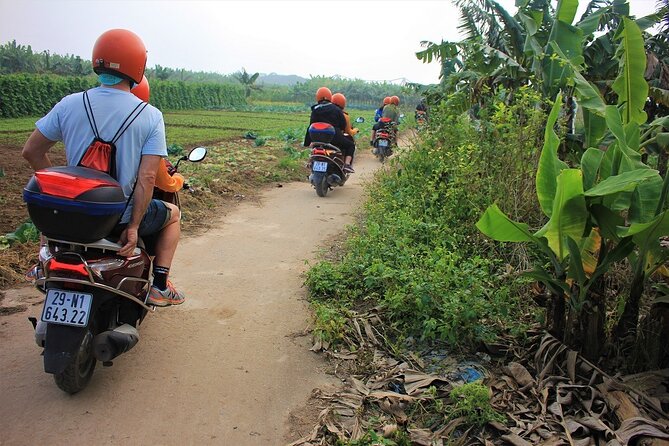 Hanoi Motorbike Tours Led By Women: Hanoi City Insight Motorbike Tours - Riding the West Lake shore and passing city landmarks
