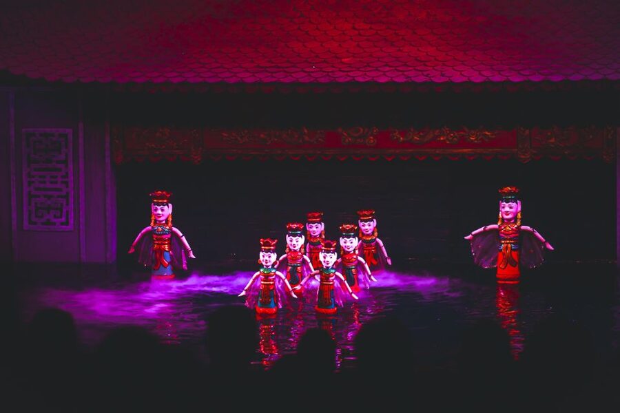 Hanoi: Water Puppet Show Ticket with Hotel Delivery Add-On - Water puppets on a flooded village stage